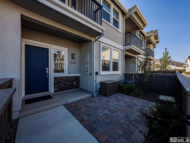 entrance to property with a patio area