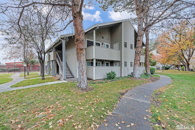 view of home's exterior with a lawn