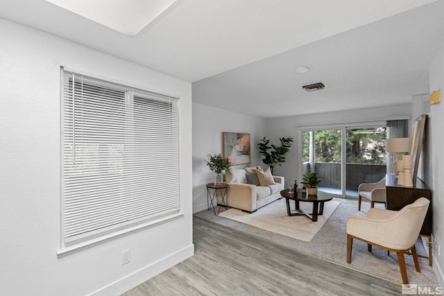 living room with light hardwood / wood-style flooring