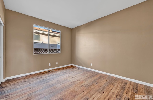 unfurnished room featuring light wood-type flooring