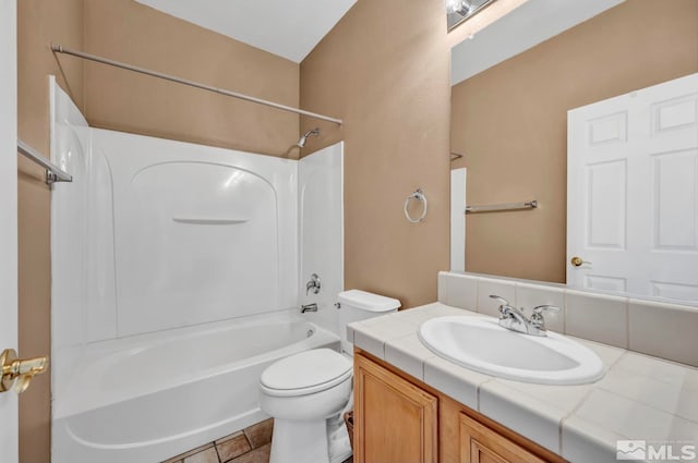 full bathroom featuring tile patterned floors, vanity, toilet, and bathing tub / shower combination