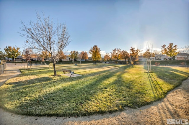 view of property's community featuring a yard