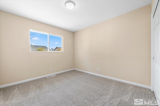 empty room featuring carpet floors