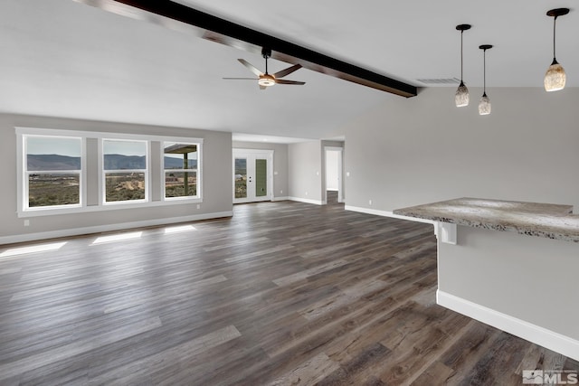 unfurnished living room with lofted ceiling with beams, dark hardwood / wood-style floors, and ceiling fan