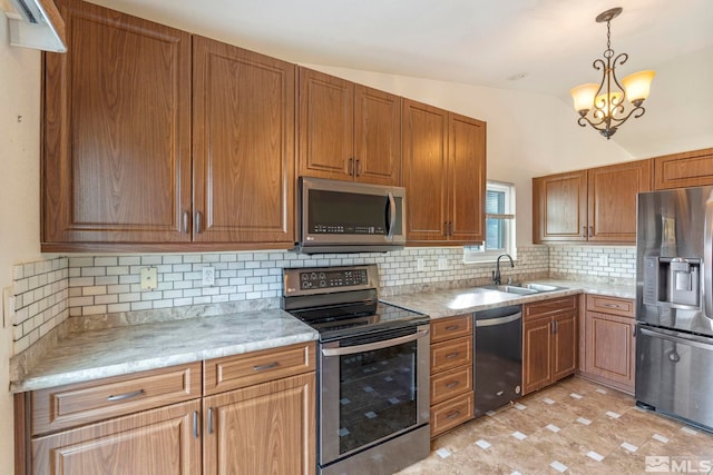 kitchen with decorative backsplash, appliances with stainless steel finishes, vaulted ceiling, decorative light fixtures, and an inviting chandelier