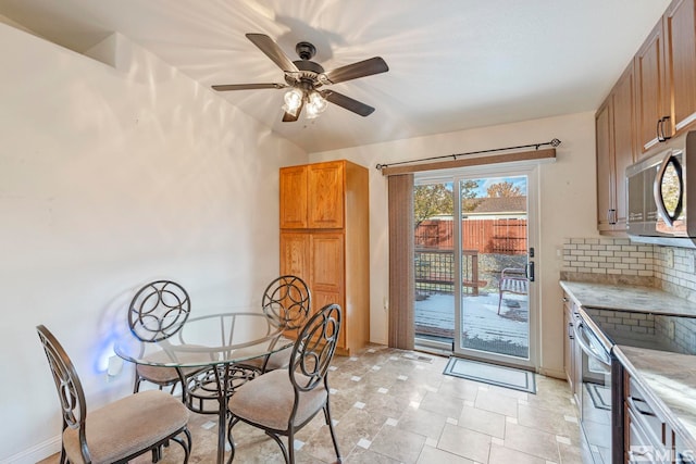 dining area featuring ceiling fan and light tile patterned floors