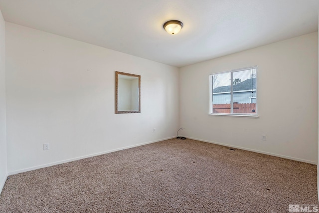 empty room with carpet flooring