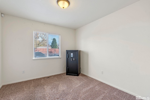 empty room with carpet flooring