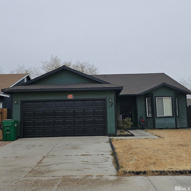 single story home featuring a garage