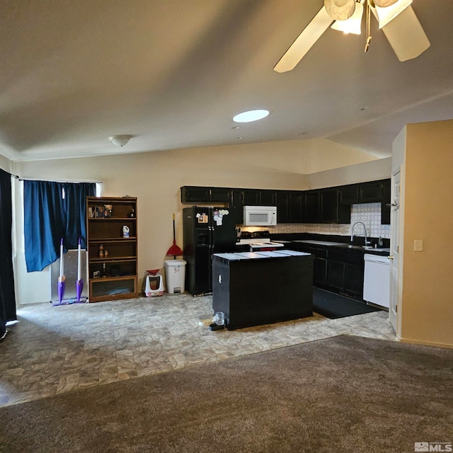 kitchen with a center island, white appliances, backsplash, ceiling fan, and light colored carpet