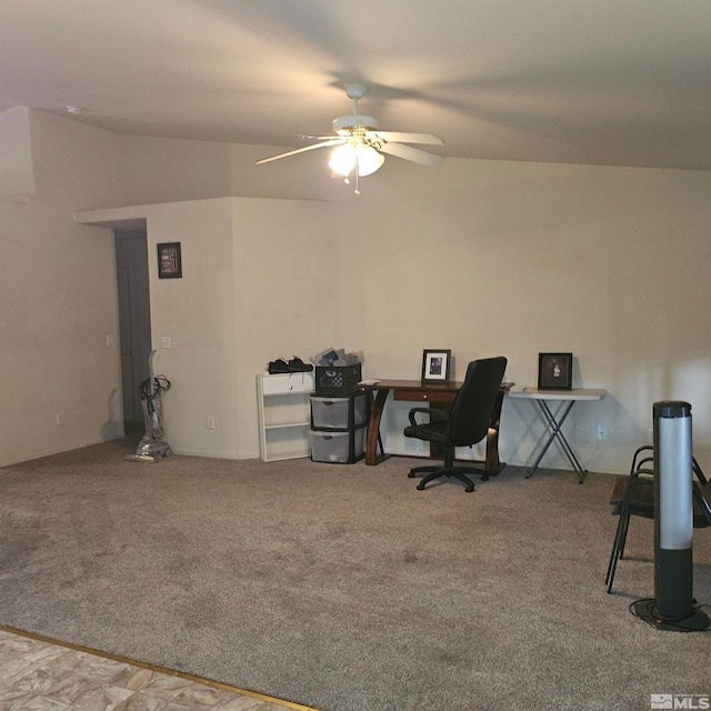 carpeted office featuring ceiling fan and lofted ceiling