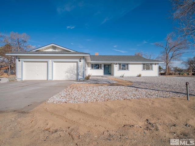 single story home featuring a garage