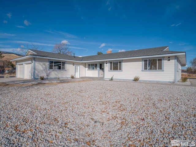 single story home featuring a garage