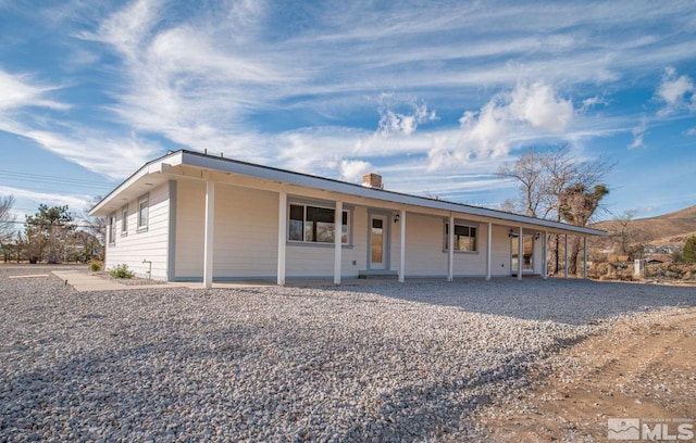 single story home with a porch