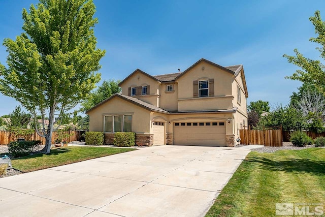 view of property with a front yard and a garage