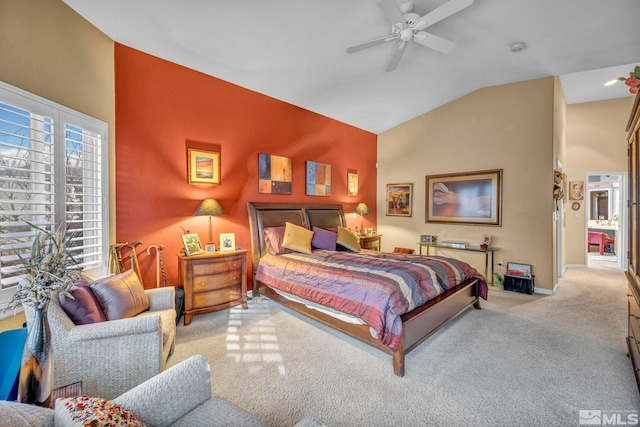 carpeted bedroom featuring ceiling fan and vaulted ceiling