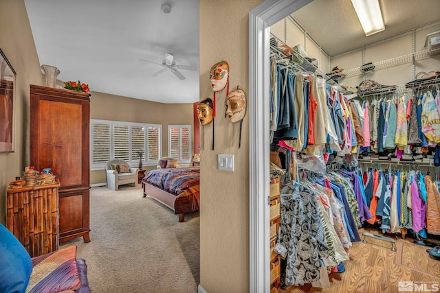 carpeted bedroom featuring ceiling fan