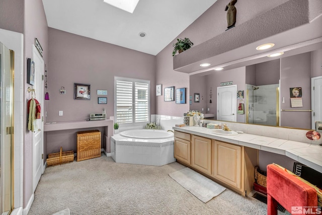 bathroom featuring vanity, lofted ceiling, and shower with separate bathtub