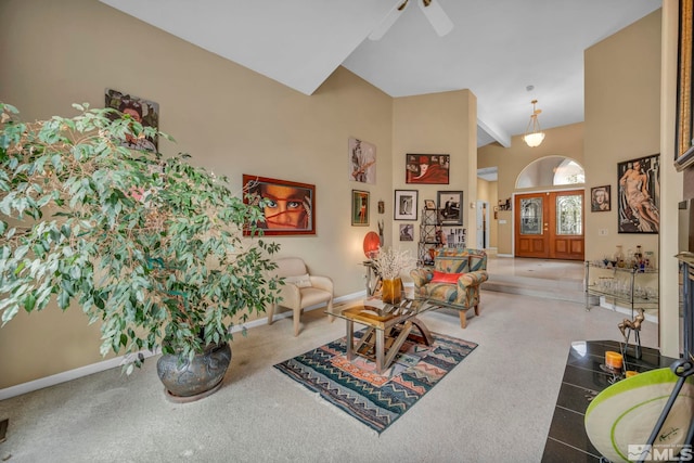 living room featuring carpet, ceiling fan, and high vaulted ceiling