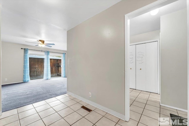 carpeted empty room with ceiling fan