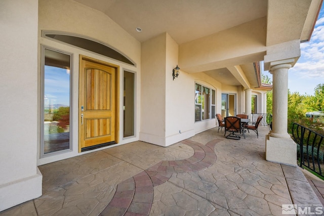 property entrance featuring covered porch