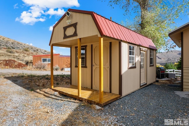 view of outdoor structure featuring a mountain view