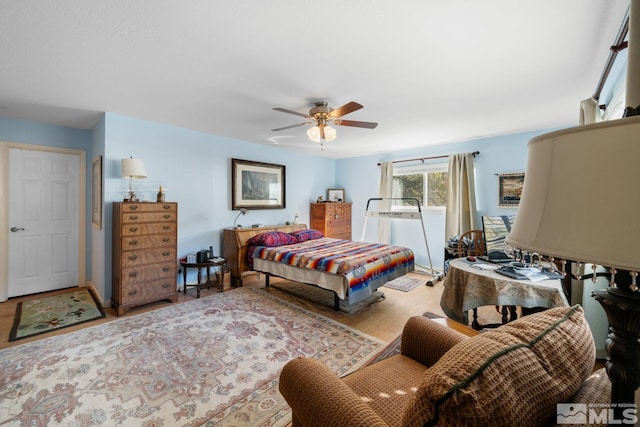 bedroom featuring wood-type flooring and ceiling fan