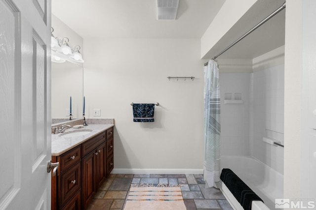 bathroom with vanity and shower / tub combo with curtain