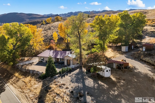 birds eye view of property featuring a mountain view