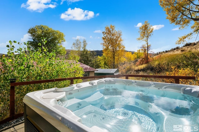 view of pool featuring a hot tub