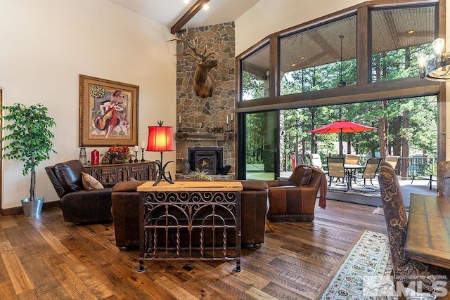 living room featuring beam ceiling, wood-type flooring, and high vaulted ceiling