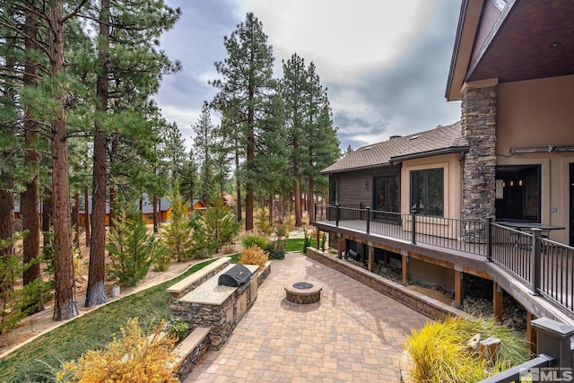 view of patio / terrace featuring a fire pit