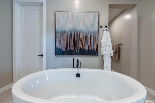 bathroom featuring a washtub