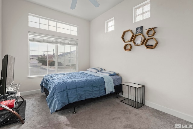 bedroom featuring light carpet and ceiling fan