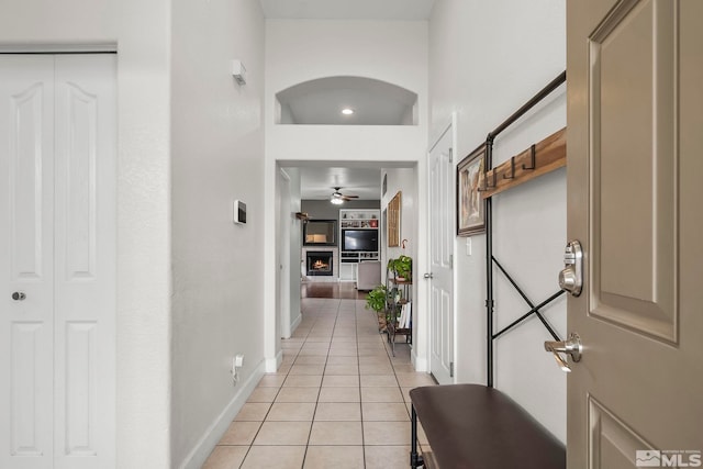 hallway featuring light tile patterned flooring