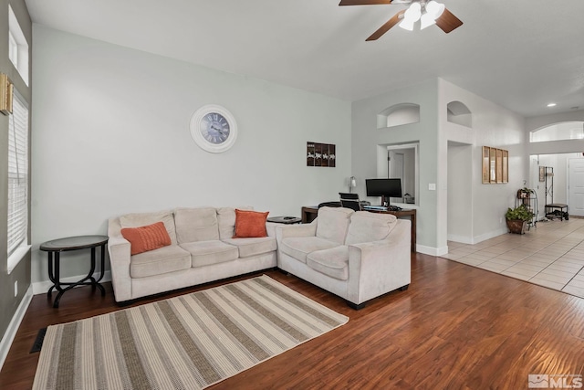 living room with hardwood / wood-style floors and ceiling fan