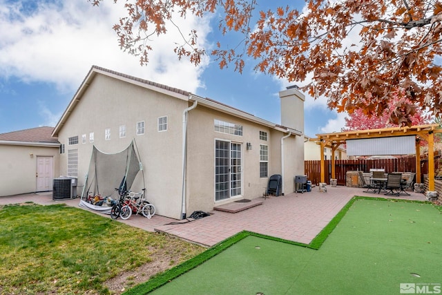 back of house featuring a pergola, a lawn, a patio area, and central air condition unit