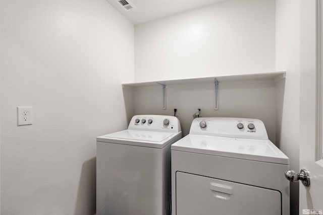 laundry room featuring washing machine and dryer