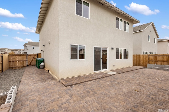 rear view of property featuring a patio