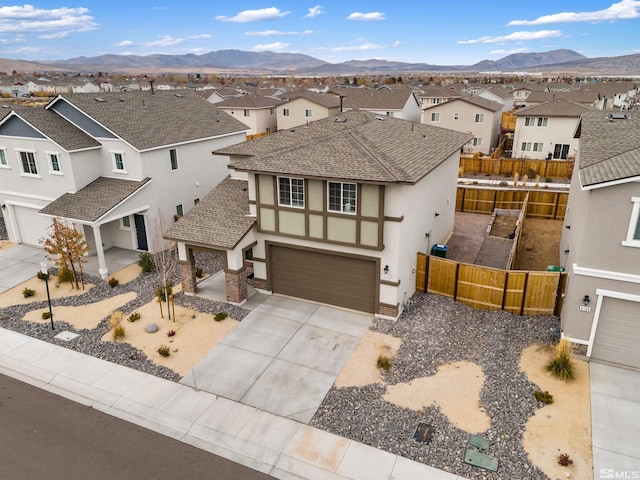 view of front of home featuring a mountain view and a garage