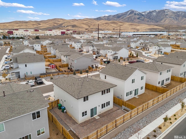 birds eye view of property with a mountain view