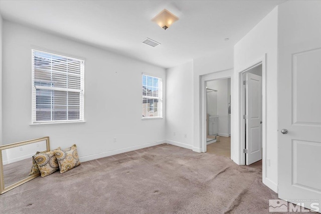 unfurnished bedroom featuring light colored carpet