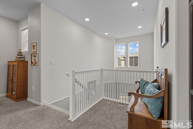 hallway featuring carpet