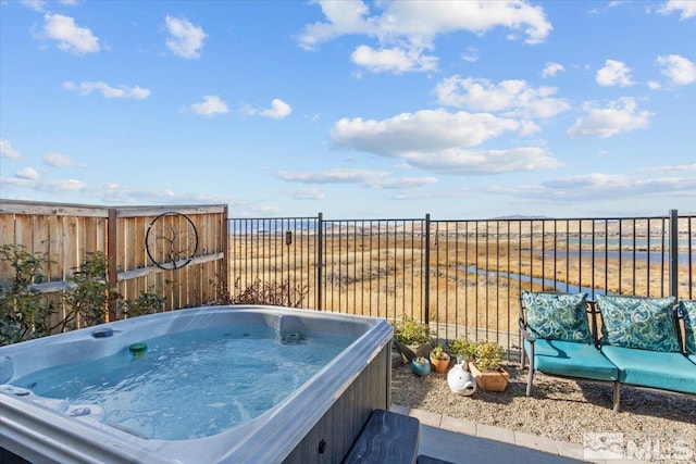 view of patio / terrace featuring a hot tub