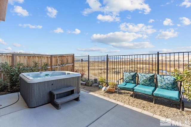 view of patio featuring an outdoor living space and a hot tub