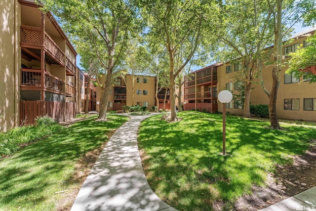 view of community featuring a yard