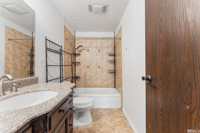 full bathroom featuring tiled shower / bath, tile patterned floors, vanity, and toilet