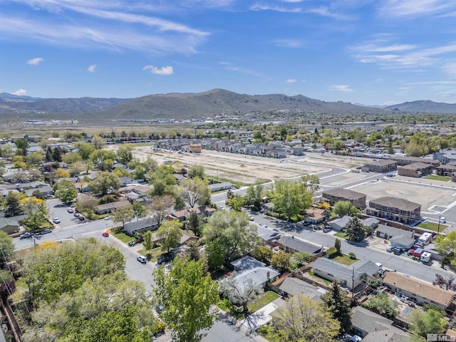 birds eye view of property with a mountain view