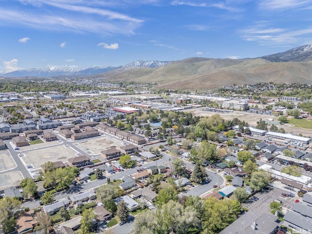 birds eye view of property with a mountain view