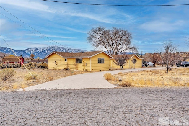 ranch-style house with a mountain view